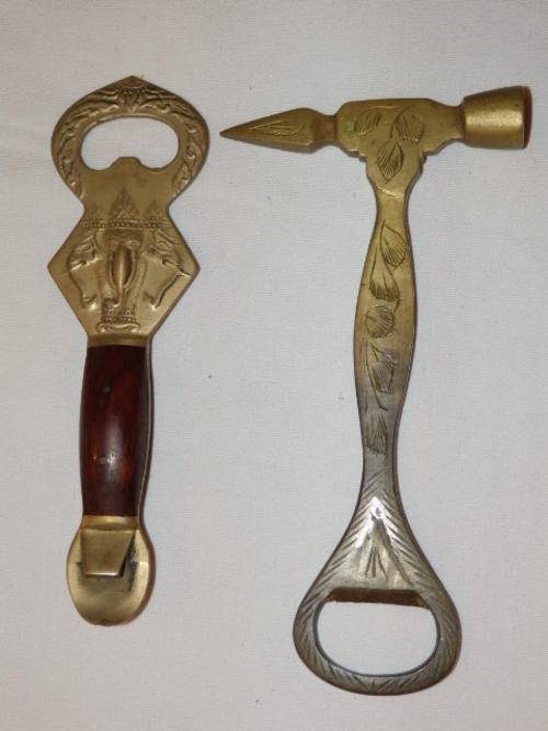 AN EXQUISITE SET OF TWO VINTAGE MATAL BOTTLE OPENERS AND ICE PICK