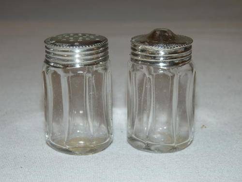 A SUPERB ENGLISH GLASS SALT AND PEPPER CELLAR SET WITH STERLING SILVER LIDS