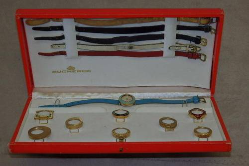 A FANTASTIC AND RARE VINTAGE (c1960's) BOXED BUCHERER GOLD PLATED INTERCHANGEABLE BEZEL WATCH SET
