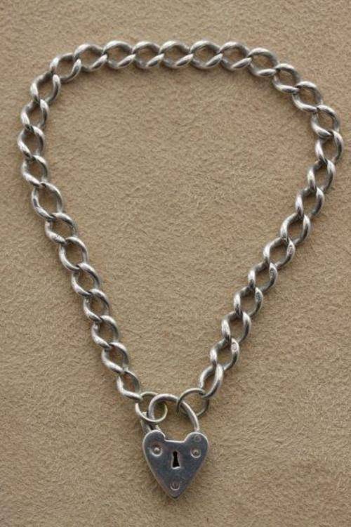 AN EXQUISITE STERLING SILVER LOCKET CHARM BRACELET!!! AWESOME PIECE FOR COLLECTING CHARMS!!!
