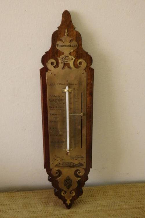 A FANTASTIC VINTAGE/ ANTIQUE BRASS "DOOR J. ADLER & COMP" THERMOMETER ON A STINKWOOD MOUNT