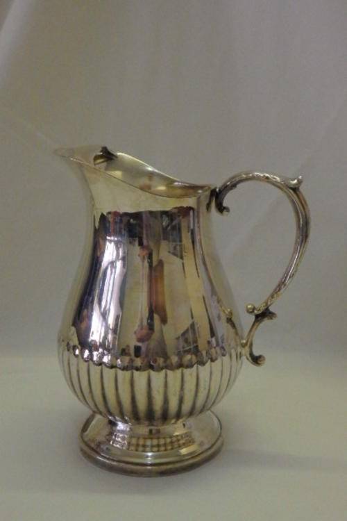 AN AWESOME "FOOTED" SILVER PLATED WATER JUG/ PITCHER WITH AN ICE LIP AND DETAILED BASE