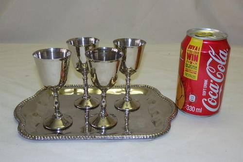 A FABULOUS SET OF FOUR SILVER PLATED SHERRY GOBLETS ON AN ENGRAVED TRAY
