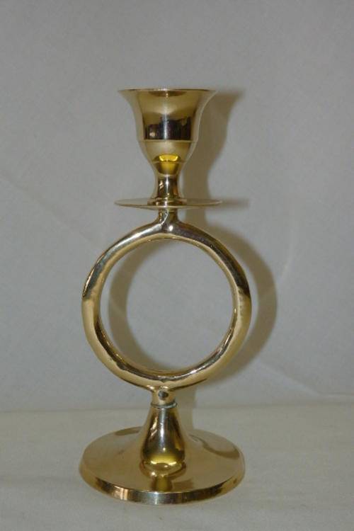 A BEAUTIFULLY HAND MADE SOLID BRASS CANDLE STICK HOLDER WITH AN UNUSUAL DESIGN