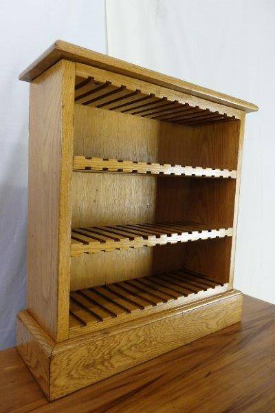 A STUNNING SOLID OAK CD RACK (CAN HOLD 39 CD's) IN EXCELLENT CONDITION!!! AWESOME...