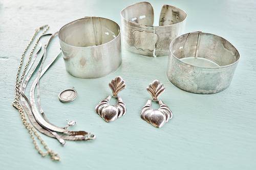 Silver Jewelery and gold chain.