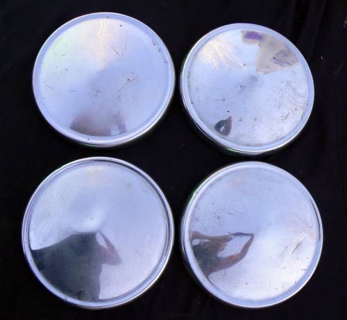 4 x Vintage Wheel caps -- (It looks like it is Plymouth caps but we are not 100% sure)