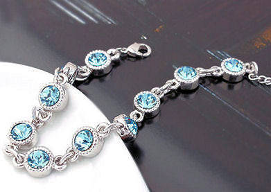 LOVELY  SWAROVSKI BLUE TOPAZ TENNIS BRACELET