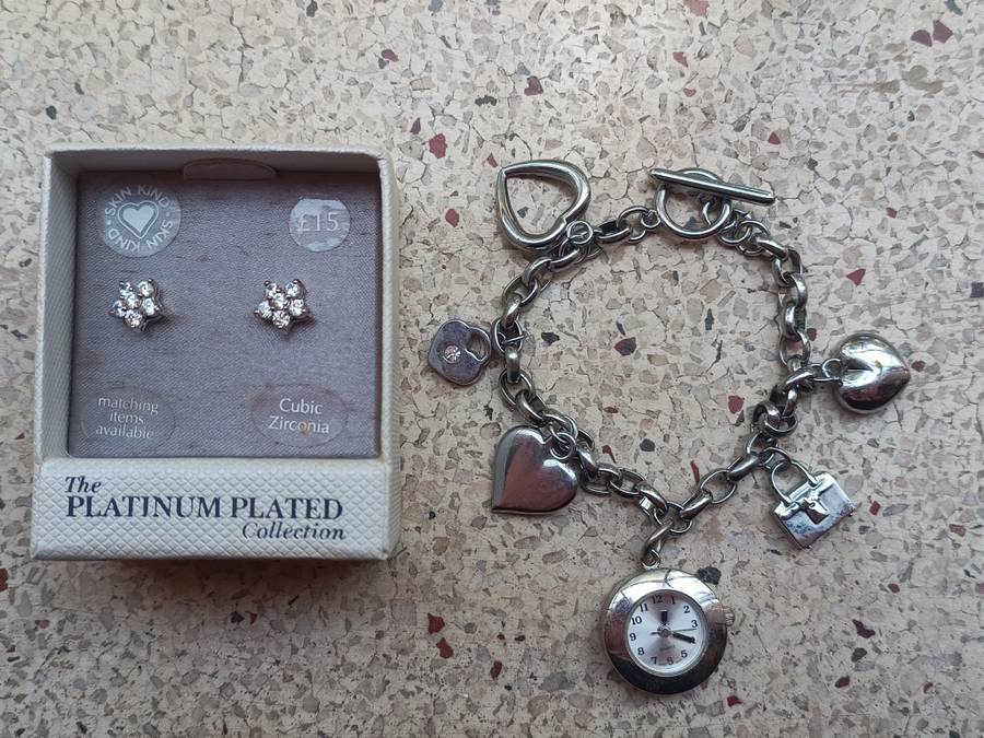 Collectors Cubic Zirconia earings from the Platinum plated collection and a charm bracelet