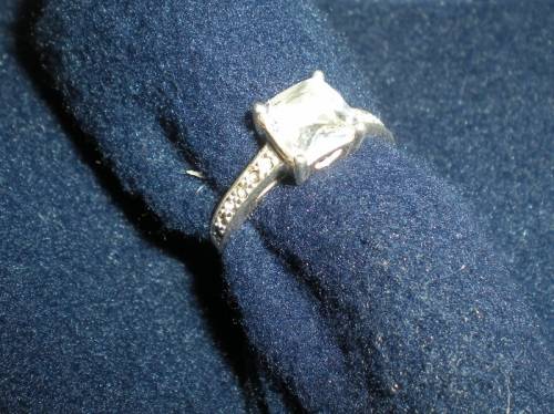 Sterling Silver Ring with one big CZ and 12 little CZ on the sides