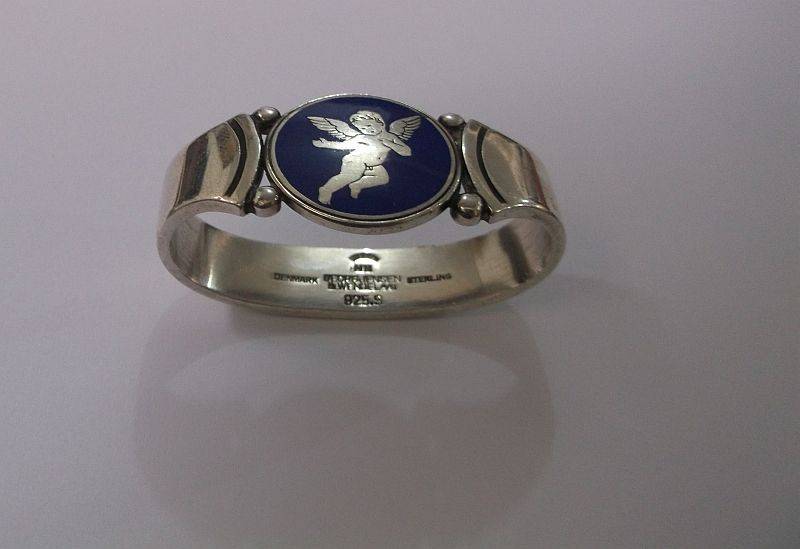 WOW !!! AN AWESOME RARE SOLID STERLING SILVER GEORG JENSEN NAPKIN RING WITH ENAMELED CHERUB MOTIF
