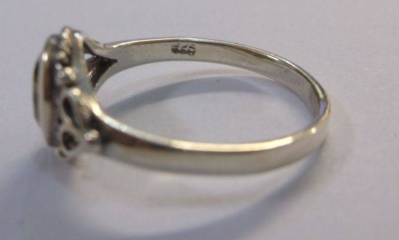 WOW !!! A VERY STYLISH SOLID STERLING SILVER RING SET WITH A FACETED GREEN STONE ....LAST ONE !!!