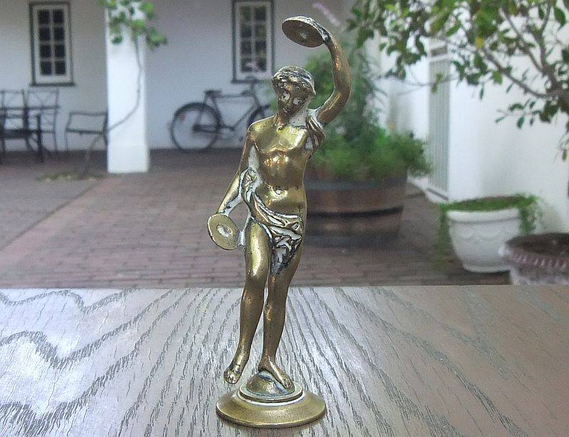 AN AWESOME OLD SOLID BRASS STATUE OF A ROMANESQUE FIGURE ...PERHAPS DANCING ...DETAILED PIECE !!
