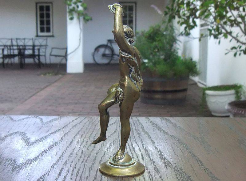 AN AWESOME OLD SOLID BRASS STATUE OF A ROMANESQUE FIGURE ...PERHAPS DANCING ...DETAILED PIECE !!