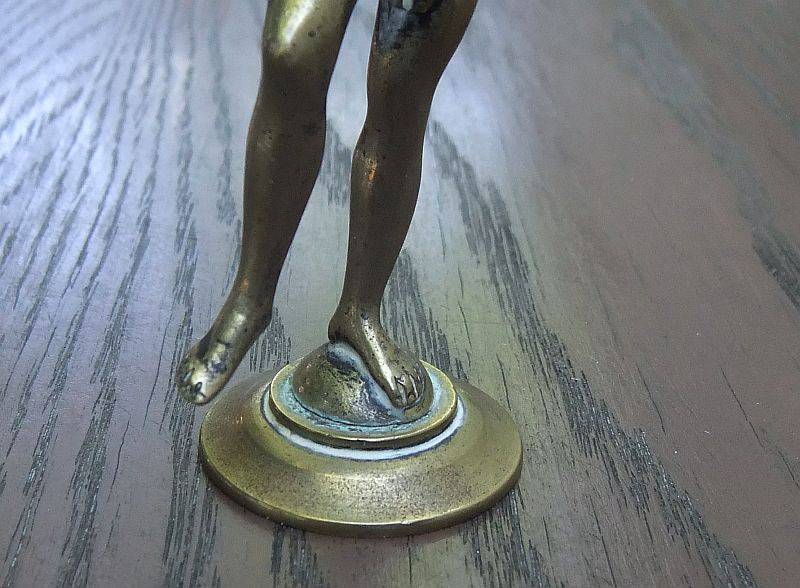 AN AWESOME OLD SOLID BRASS STATUE OF A ROMANESQUE FIGURE ...PERHAPS DANCING ...DETAILED PIECE !!
