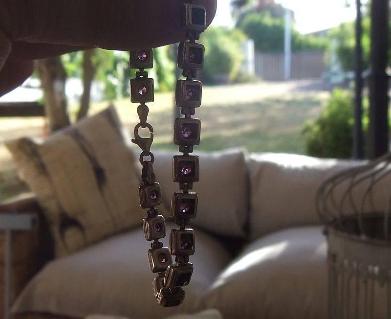 A GORGEOUS VINTAGE STERLING SILVER BRACELET SET WITH FACETED PURPLE STONES !! HINGED !! MUST HAVE !!