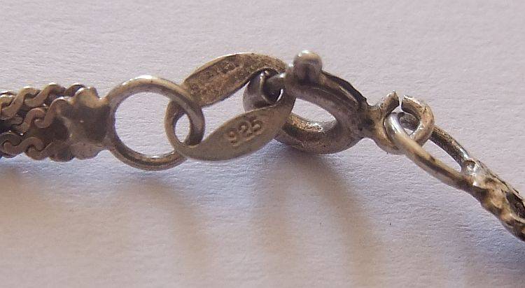 A STYLISH STERLING SILVER NECKLACE WITH A STERLING SILVER CROSS PLUS 3 STERLING SILVER RINGS !! WOW