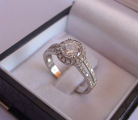 A SPARKLING SOLID STERLING SILVER RING SET WITH LOTS OF FACETED CZ STONES