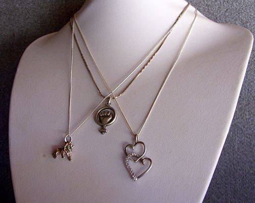 THREE SOLID STERLING SILVER NECKLACES WITH THREE EYE CATCHING STERLING SILVER PENDANTS !!!