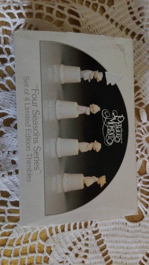 4 Boxed Enesco Precious Moments Four seasons limited edition thimbles.