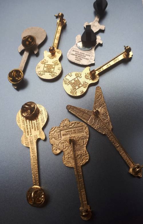 Hard Rock Cafe Guitar pins x 6 plus one other rock guitar