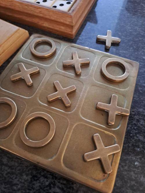 Noughts and Crosses in brass, vintage Domino box set and Africa Metal Puzzle (roughly 20 cm x 15 cm)