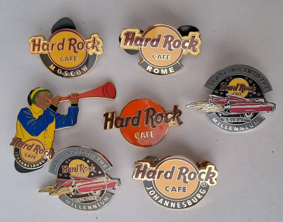 Hard Rock Cafe vintage pin badges  7 in total, one being the classic old style Hard Rock logo
