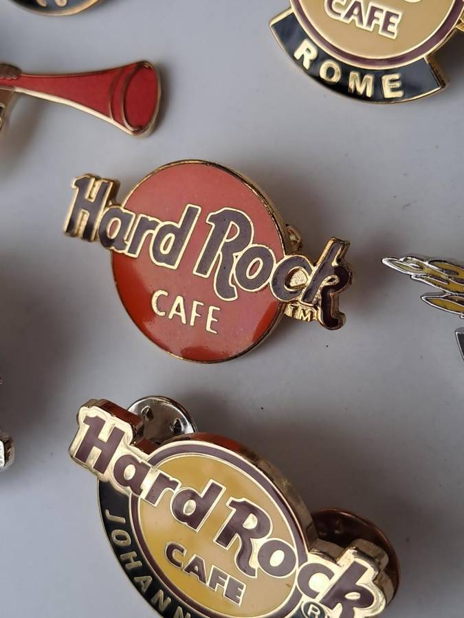Hard Rock Cafe vintage pin badges  7 in total, one being the classic old style Hard Rock logo
