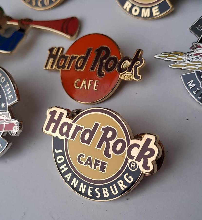 Hard Rock Cafe vintage pin badges  7 in total, one being the classic old style Hard Rock logo