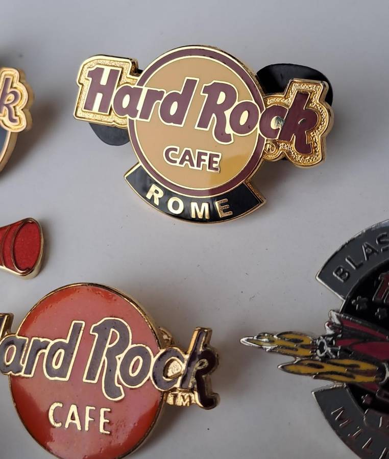 Hard Rock Cafe vintage pin badges  7 in total, one being the classic old style Hard Rock logo