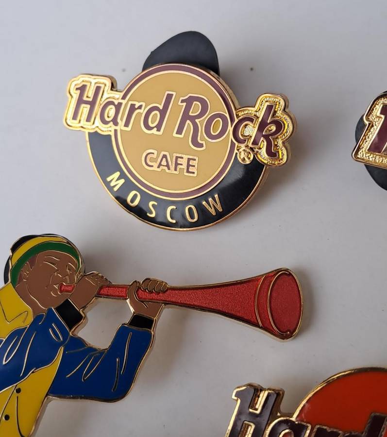 Hard Rock Cafe vintage pin badges  7 in total, one being the classic old style Hard Rock logo