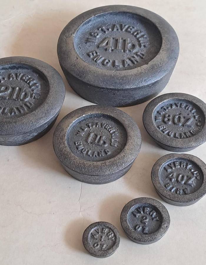 Antique cast-iron imperial weights as used in old home kitchens and grocery stores