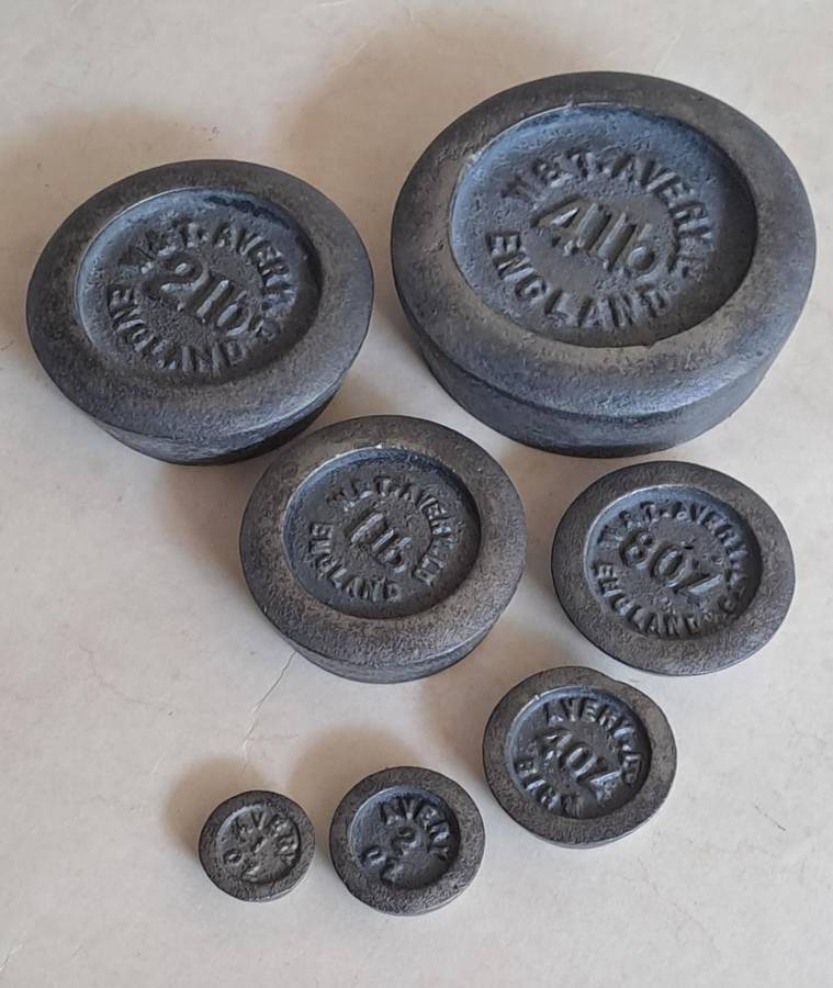 Antique cast-iron imperial weights as used in old home kitchens and grocery stores
