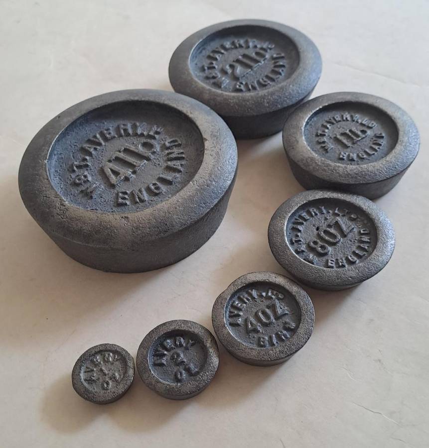 Antique cast-iron imperial weights as used in old home kitchens and grocery stores