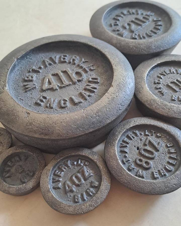Antique cast-iron imperial weights as used in old home kitchens and grocery stores