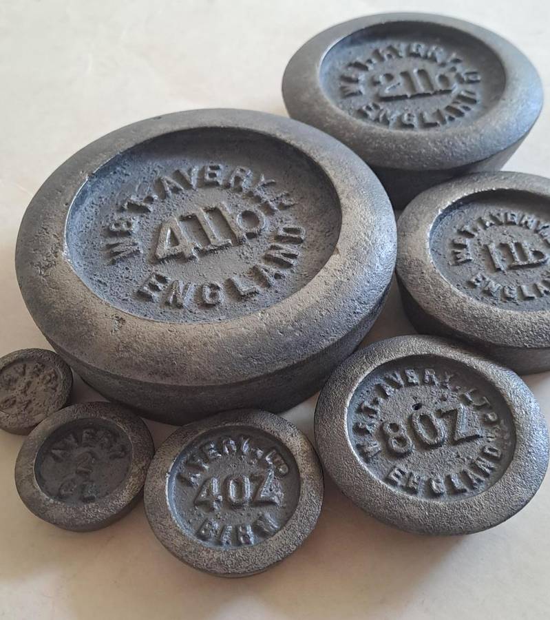 Antique cast-iron imperial weights as used in old home kitchens and grocery stores