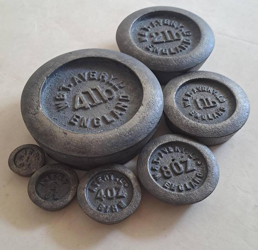 Antique cast-iron imperial weights as used in old home kitchens and grocery stores