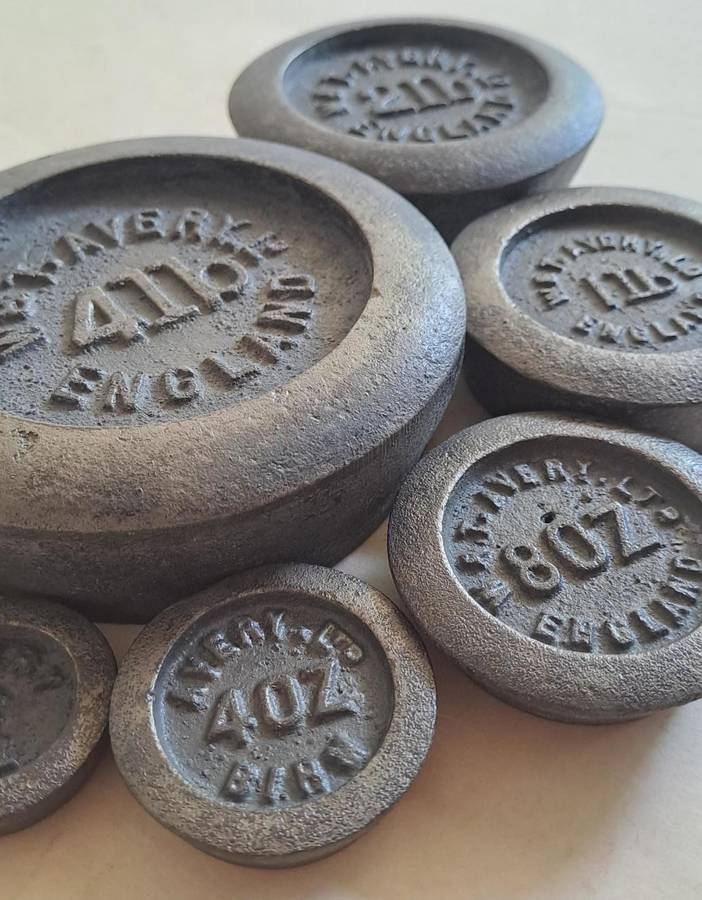 Antique cast-iron imperial weights as used in old home kitchens and grocery stores
