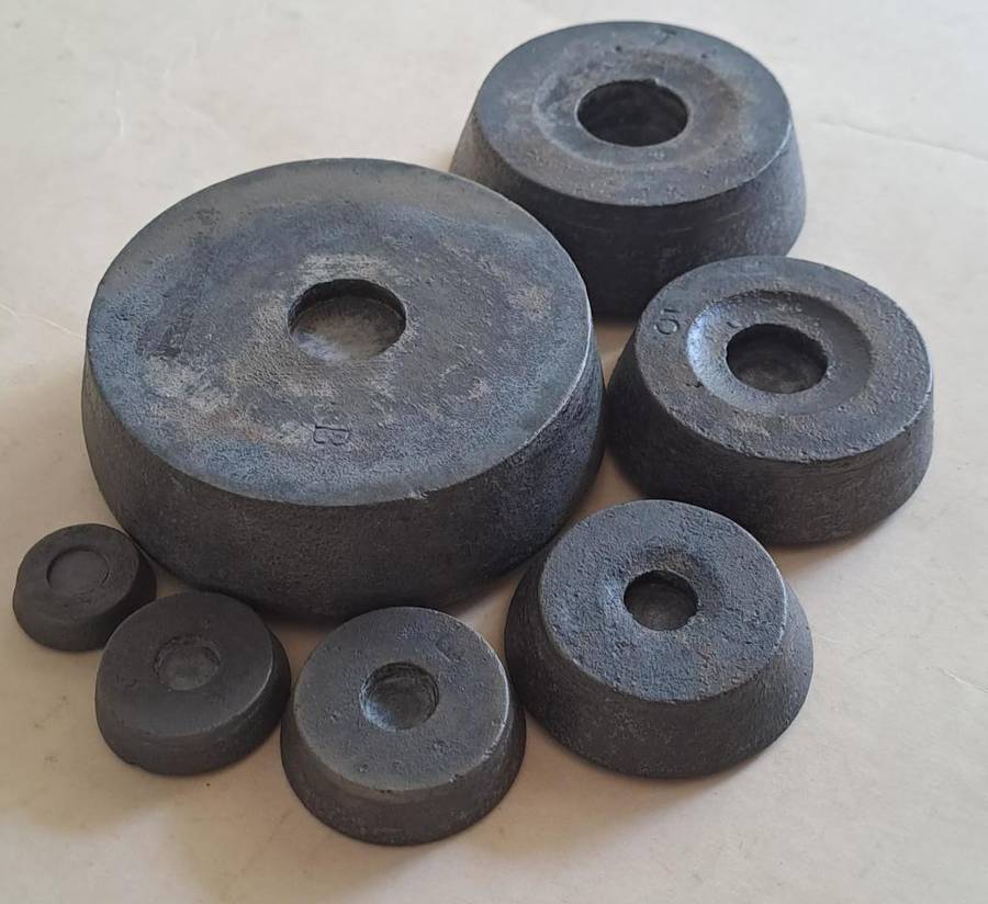 Antique cast-iron imperial weights as used in old home kitchens and grocery stores