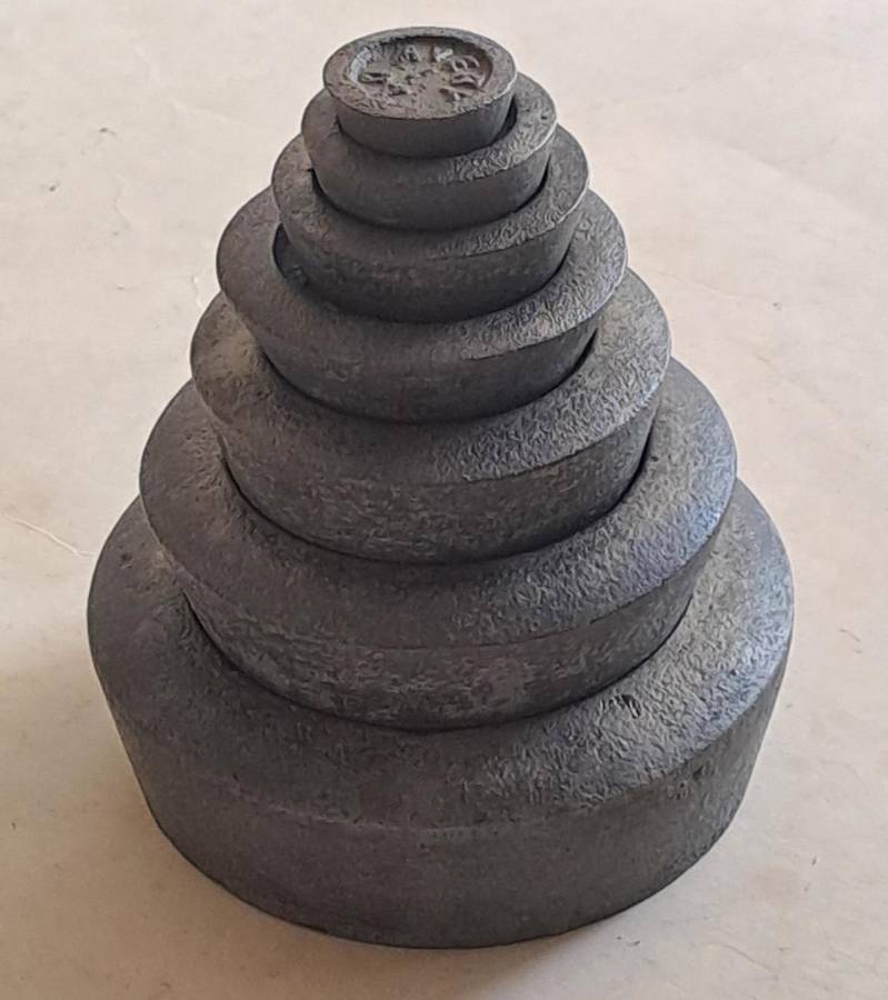 Antique cast-iron imperial weights as used in old home kitchens and grocery stores