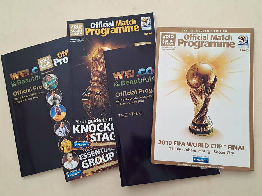 FIFA World Cup Tournament brochures and 2010 Final Programmes with Zakumi mascot and pin badge