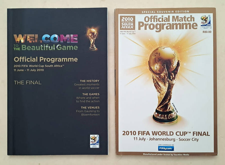 FIFA World Cup Tournament brochures and 2010 Final Programmes with Zakumi mascot and pin badge