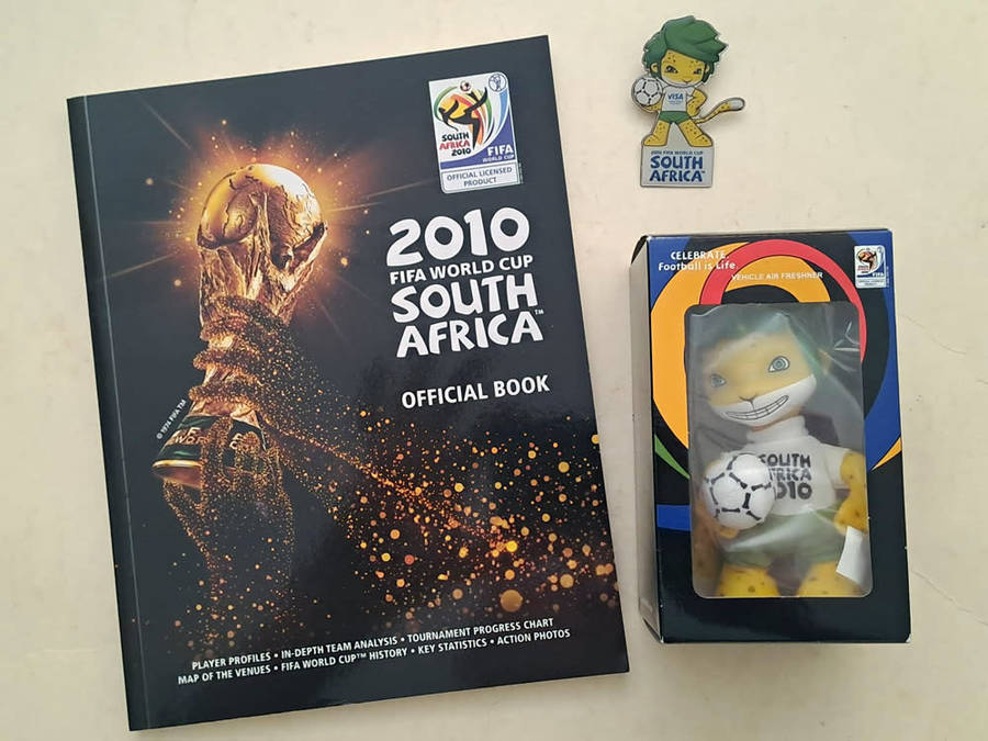 FIFA World Cup Tournament brochures and 2010 Final Programmes with Zakumi mascot and pin badge