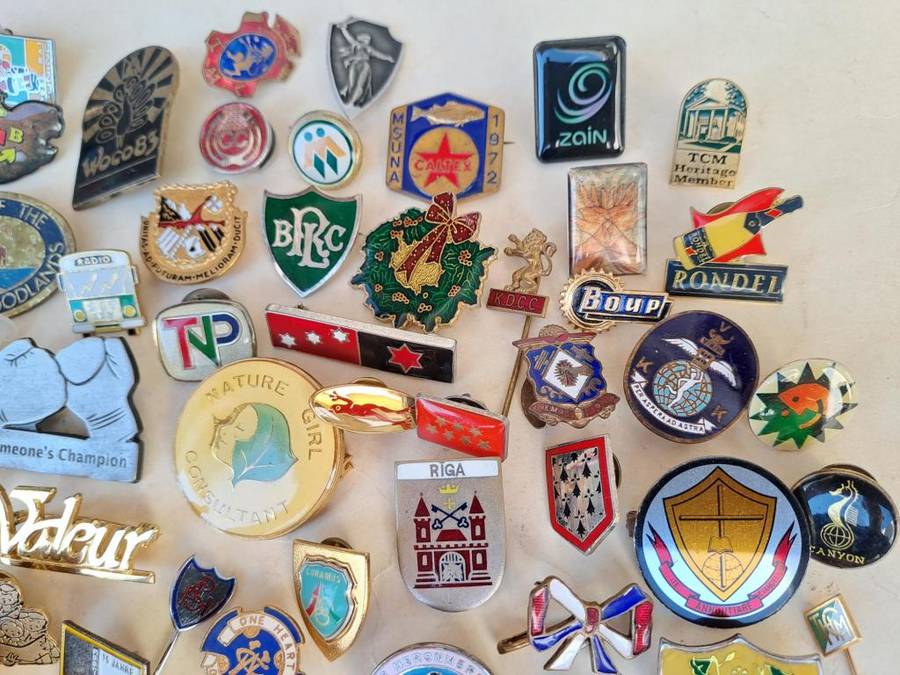 100 pin badges in all sizes and subject matter
