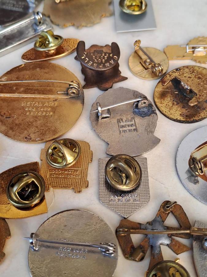 100 pin badges in all sizes and subject matter