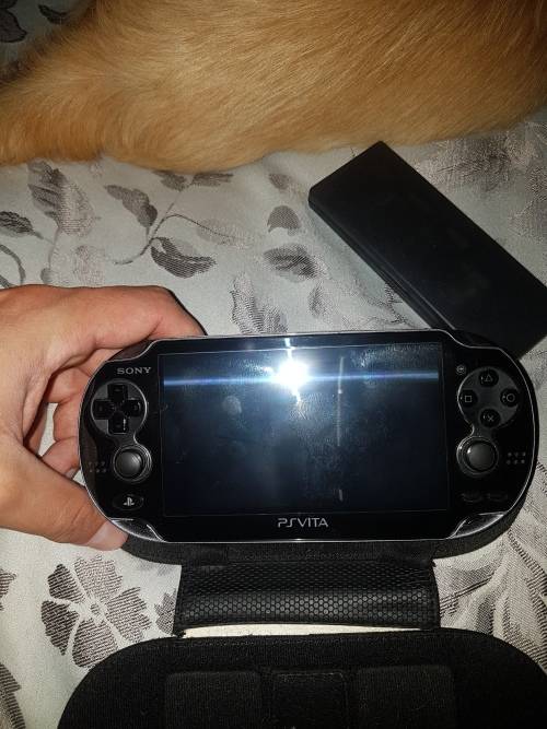 Basically new Ps Vita with 8 games and 4gb memory card.
