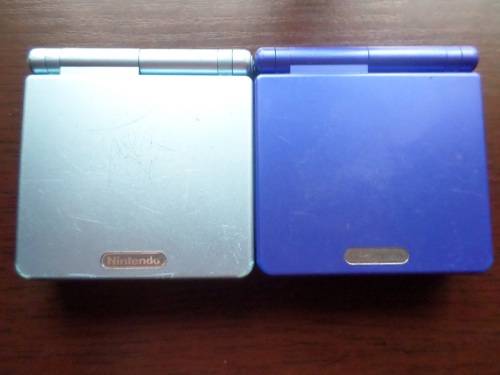 2 X Gameboy Advanced SP Consoles (Pearl Blue, and Cobalt Blue) + Game