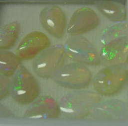 Incredible .20 ctw each Genuine White Opal with Pear Shape and Cabochon cut, 6x4 mm each