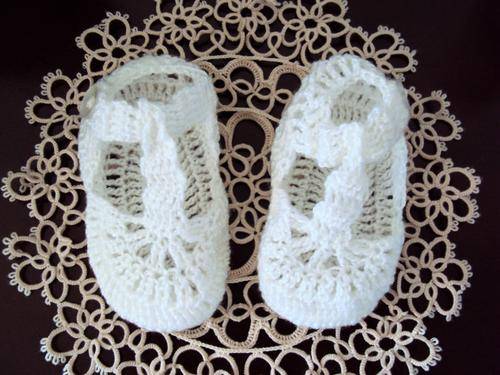 White hand crochet baby bootees