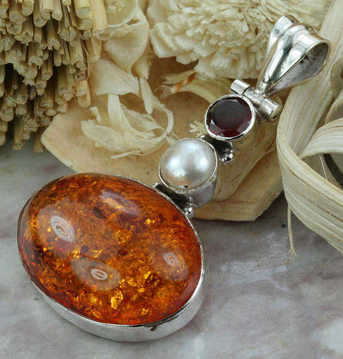 MARYKAY - NATURAL FANCY PRESSED AMBER, PEARL AND GARNET .925 STERLING SILVER PENDANT